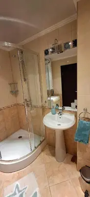 a bathroom with a shower and a sink and a tub at Stunning Sea View Studio in Andalucia Beach Hotel by Flat Mаnager in Elenite