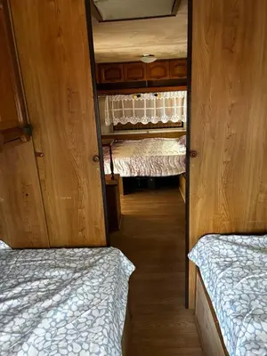 an empty room with two beds in a van at Нереида in Sozopol