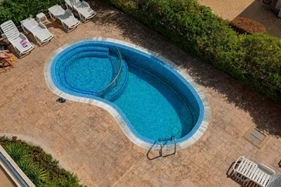an overhead view of a swimming pool with chairs at Belle View - Menada Apartments in Sveti Vlas