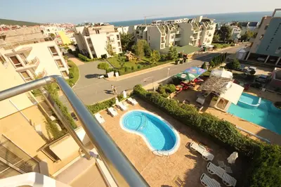 a view of a swimming pool on a balcony of a building at Belle View - Menada Apartments in Sveti Vlas