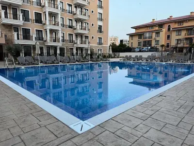a swimming pool in front of a building at Apartment Summer Vibes in Sveti Vlas