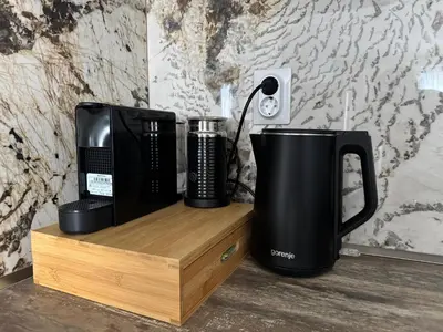 a desk with two coffee machines on a wooden stand at Apartment Summer Vibes in Sveti Vlas