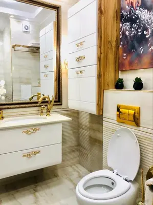 a bathroom with a white toilet and a mirror at Sea View Apartments Residence Лазурен бряг in Burgas City