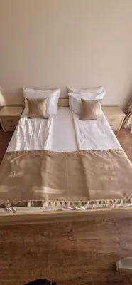 a bed with two pillows on top of it at Premier Fort Beach Hotel in Sveti Vlas