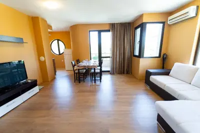 a living room with a couch and a table at GGeorgi Sarafovo in Burgas City