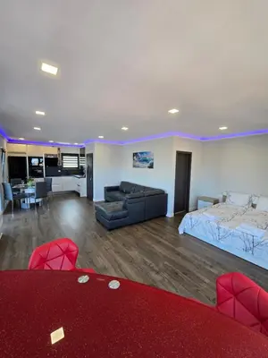 a large living room with a bed and a couch at Къща Холидей Обзор in Obzor