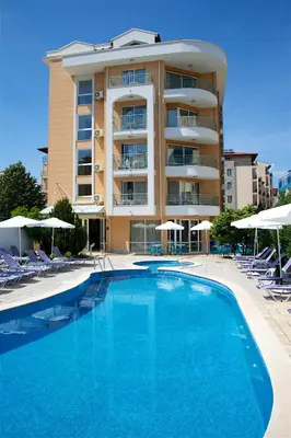 a large swimming pool in front of a hotel at Sunny Residence complex in Sunny Beach