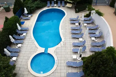 an overhead view of a swimming pool with lounge chairs at Sunny Residence complex in Sunny Beach