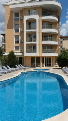 a large swimming pool in front of a building at Sunny Residence complex in Sunny Beach