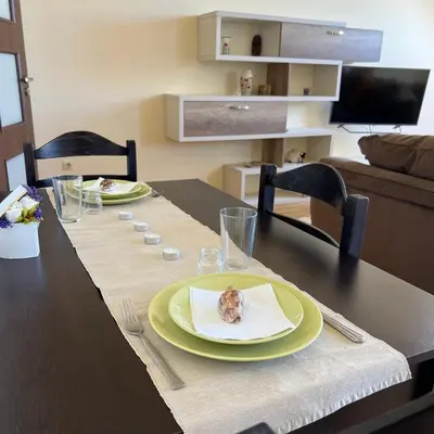 a table with a plate with a piece of food on it at Морска Идилия in Burgas City
