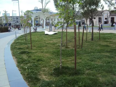 a park with a bunch of trees in the grass at Apartment Alyosha in Burgas City