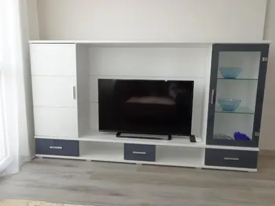 a large entertainment center with a flat screen tv at Apartment Alyosha in Burgas City
