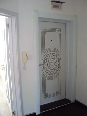 a door with a design on it in a room at Apartment Alyosha in Burgas City