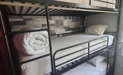 a couple of bunk beds in a room at AT Home in Burgas City