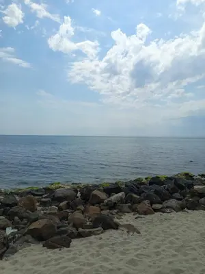 a group of rocks on a beach near the water at Ваканционен Апартамент in Aheloy