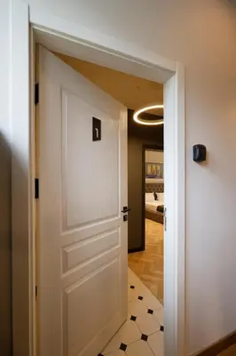 a door leading into a hallway with a room at Tsaribrod Design Apartments in Varna City