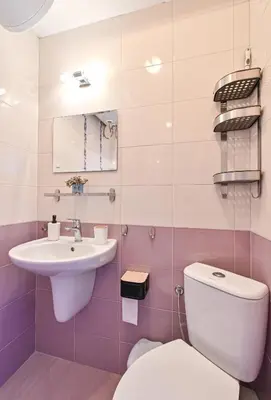a bathroom with a toilet and a sink at Via Sunride 1 - Maisonette Apartment by the sea in Sozopol