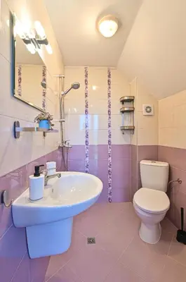 a bathroom with a sink and a toilet at Via Sunride 1 - Maisonette Apartment by the sea in Sozopol