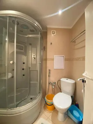 a bathroom with a shower and a toilet at Robinzon Beach 3BD Lux apartment by Flat Mаnager in Elenite
