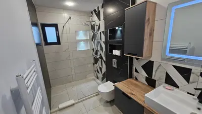 a bathroom with a toilet and a sink at Холидей Обзор-Стая in Obzor