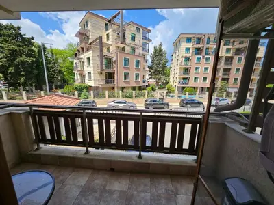 a balcony with a view of a street with buildings at Romantic Sensual Retreat Studio by Flat Mаnager in Ravda
