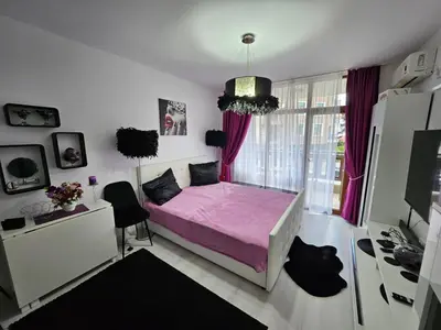 a bedroom with a pink bed and a window at Romantic Sensual Retreat Studio by Flat Mаnager in Ravda