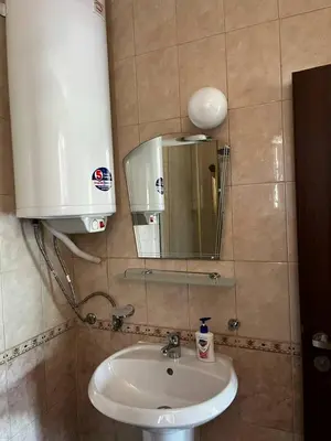a bathroom with a sink and a mirror at Paradise apartment Sozopol in Sozopol