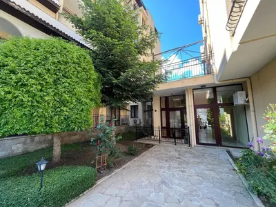 a house with a walkway in front of a building at Rose Village Apartment in Sunny Beach