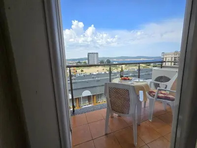 a view of a balcony with a table and chairs at Sea View Dune Apartment in Sunny Beach