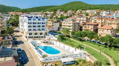 a view of a city with a pool and buildings at Hotel Laguna SPA in Sveti Vlas