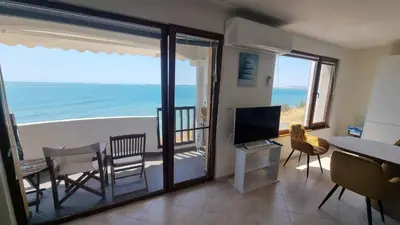a living room with a view of the ocean at Под наем 4-стаен Апартамент с Изумителна фронтална гледка море, Sun Coast resort Свети Влас in Sveti Vlas