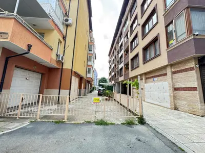 a gate in the middle of a street between two buildings at Sofronii Pomorie Residence in Pomorie