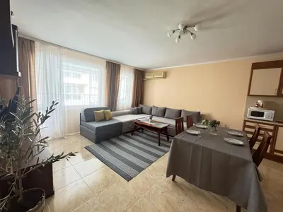 a living room with a couch and a table at Sofronii Pomorie Residence in Pomorie