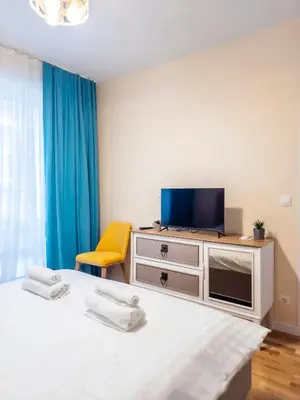 a bedroom with two beds and a tv on a dresser at Arena MALL Galleria Securities Parking 3 in Burgas City