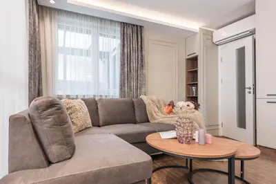a living room with a couch and a table at City Center Luxury Apartments in Varna City
