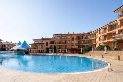 a large swimming pool in front of some buildings at Panorama Dreams - Prestige Apartments in Sveti Vlas