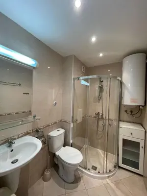 a bathroom with a toilet and a shower and a sink at Panorama Dreams - Prestige Apartments in Sveti Vlas