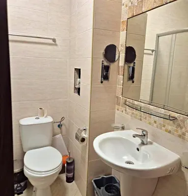 a bathroom with a toilet and a sink at Studio for rent Cascadas in Sunny Beach