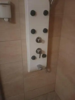 a shower with four black dials in a bathroom at Barbie-Themed 3BDR Penthouse Near The Beach, Nessebar in Nesebar