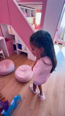 a little girl standing in a pink room at Barbie-Themed 3BDR Penthouse Near The Beach, Nessebar in Nesebar