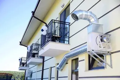 a building with a security camera on the side of it at Къща за гости Силвия in Shkorpilovtsi