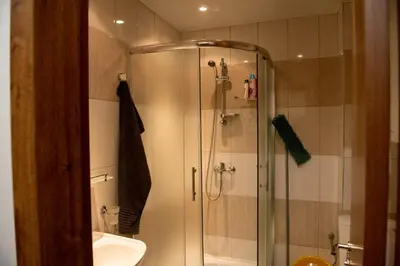 a bathroom with a shower and a sink at Морски бриз in Shkorpilovtsi