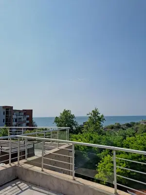 a balcony with a view of the water at Sineva Apartments in Ravda
