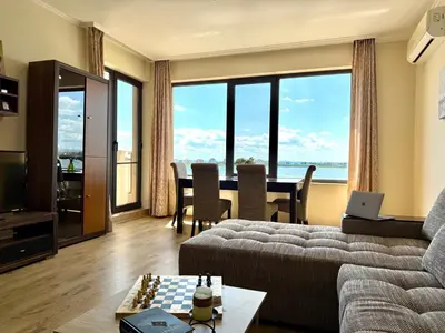 a living room with a couch and a table at Cosher - Gardenia Palace Apt 11 Free Parking in Pomorie