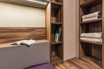 a room with bookshelves and a book shelf at City Center Luxury Studio in Varna City