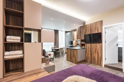 a living room with a kitchen and a dining room at City Center Luxury Studio in Varna City