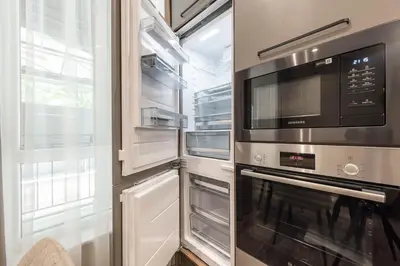 a kitchen with an oven and a microwave at City Center Luxury Studio in Varna City