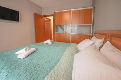 a bedroom with two beds with towels on them at Stylish Holiday Apartments in Karolina in Sunny Beach