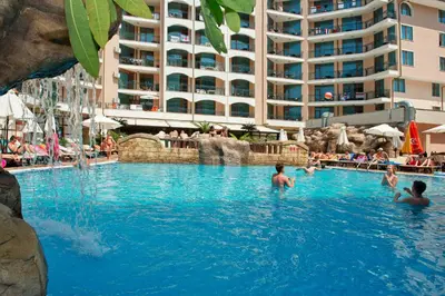 a pool at a hotel with people in the water at Stylish Holiday Apartments in Karolina in Sunny Beach
