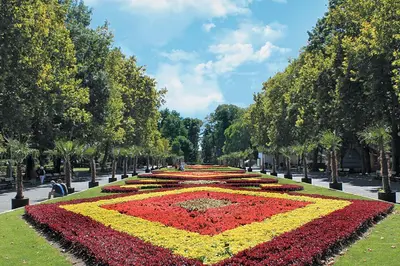 a large flower clock in the middle of a park at Deluxe studio beach Lazur in Burgas City